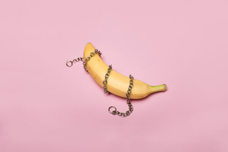 A banana with a chain wrapped around