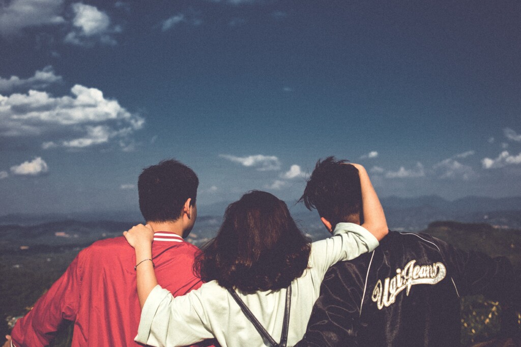 Three people looking out to scenery