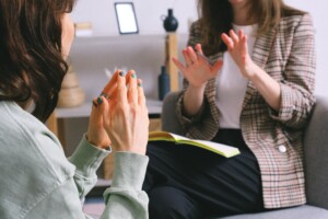 Two people talking and using hand gestures